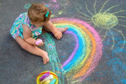 baby-draws-a-rainbow-on-the-pavement-with-chalk-s-2022-06-10-08-17-50-utc-scaled.jpg