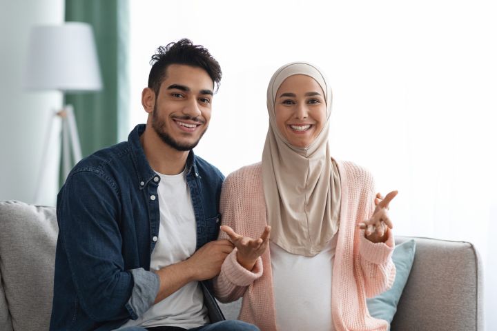 happy-news-cheerful-pregnant-muslim-couple-talkin-2022-12-16-06-49-27-utc-scaled.jpg