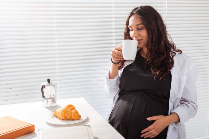 pregnant-woman-eating-breakfast-pregnancy-and-mat-2021-12-09-20-53-41-utc-scaled.jpg