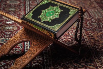 the-holy-book-of-the-koran-on-the-stand-2021-12-21-00-46-40-utc-scaled.jpg