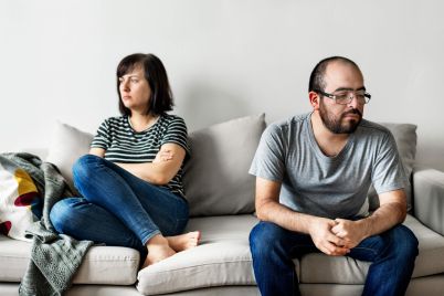 unhappy-couple-arguing-on-the-sofa-2021-08-27-00-03-14-utc-scaled.jpg